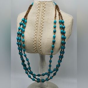 Tugende Design Sophie.  Blue recycled beads with gold /copper seed beads